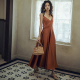 2025 2025 new women's seaside vacation skirt satin sexy backless suspender beach skirt long V-neck waist long skirt