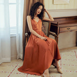 2025 2025 new women's seaside vacation skirt satin sexy backless suspender beach skirt long V-neck waist long skirt