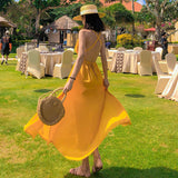 2025 2025 new Hainan Sanya yellow beach dress women's summer seaside vacation suspender backless sexy dress super fairy