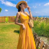 2025 2025 new Hainan Sanya yellow beach dress women's summer seaside vacation suspender backless sexy dress super fairy