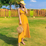 2025 2025 new Hainan Sanya yellow beach dress women's summer seaside vacation suspender backless sexy dress super fairy
