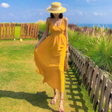 2025 2025 new Hainan Sanya yellow beach dress women's summer seaside vacation suspender backless sexy dress super fairy