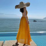 2025 Beach skirt 2025 new women's summer super fairy yellow backless dress seaside vacation dress elegant and swinging