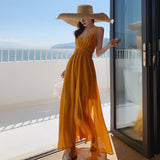 2025 Beach skirt 2025 new women's summer super fairy yellow backless dress seaside vacation dress elegant and swinging