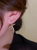 High-end light luxury zircon bow earrings, women's personality design earrings, sweet versatile ear jewelry