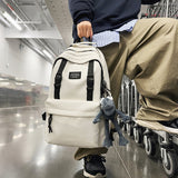 2025 Large capacity backpack couple schoolbag new junior high school high school college student schoolbag leisure travel bag lightweight backpack