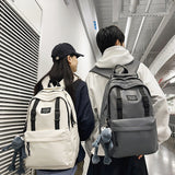 2025 Large capacity backpack couple schoolbag new junior high school high school college student schoolbag leisure travel bag lightweight backpack