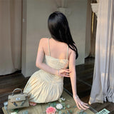 2025 neck V-neck suspender dress women's spring and summer temperament waist pleated A-shaped skirt vacation style medium and long skirt
