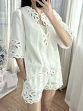 2025 Korean atmosphere wearing white hollow shirt shorts two-piece set  super fire age reduction spring women's clothing