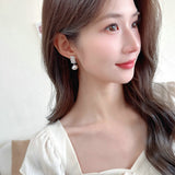 2025 New  retro fashion earrings women's light luxury niche high-end super personalized design flash zircon pearl earrings