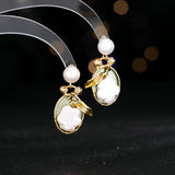 2025 literary retro elegant temperament earrings female court style high sense dripping oil leaf baroque pearl earrings