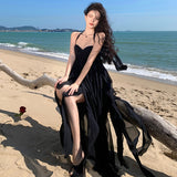 2025 Sanya seaside vacation dress sexy pure desire irregular skirt halter split neck black beach dress