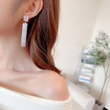 2025 Luxury high-end earrings wholesale, bright full zirconium inlaid banquet dress with long face-showing thin fringed earrings