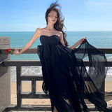2025 Sanya seaside vacation dress sexy pure desire irregular skirt halter split neck black beach dress