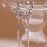 Light luxury high-end zircon winding long fringed earrings women's new trendy niche design temperament cold wind earrings