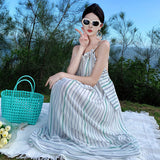2025 Seaside vacation skirt backless photo beach skirt neck striped dress women's niche sexy beautiful suspender dress