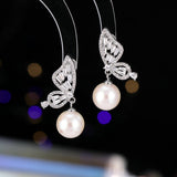2025 Temperament niche high-end earrings wholesale new trendy fashion small simple zircon inlaid pearl butterfly earrings