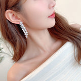 2025 Luxury exaggerated earrings design sense geometric wavy zircon inlaid long banquet dress with earrings wholesale