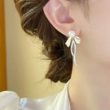 Bow pearl stud earrings new trendy long fringed earrings women's light luxury temperament versatile high-end silver needle earrings