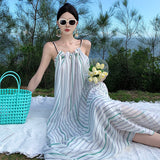 2025 Seaside vacation skirt backless photo beach skirt neck striped dress women's niche sexy beautiful suspender dress