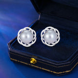2025 S925 silver needle light luxury fashion elegant temperament earrings women's high-end design sense three-dimensional hollow flower pearl stud earrings