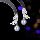 2025 Temperament niche high-end earrings wholesale new trendy fashion small simple zircon inlaid pearl butterfly earrings