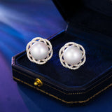 2025 S925 silver needle light luxury fashion elegant temperament earrings women's high-end design sense three-dimensional hollow flower pearl stud earrings
