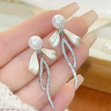 Bow pearl stud earrings new trendy long fringed earrings women's light luxury temperament versatile high-end silver needle earrings