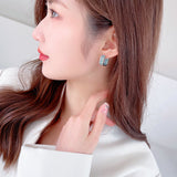 2025 Light luxury high-end earrings, geometric simplicity and versatility, slightly inlaid with zirconium three-dimensional square earrings, designer ear buckles