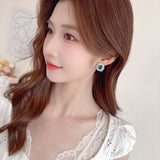2025 Summer simple temperament niche high-end earrings fashionable small fresh geometric fireworks earrings zircon jewelry wholesale