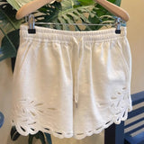 2025 Korean atmosphere wearing white hollow shirt shorts two-piece set  super fire age reduction spring women's clothing